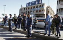 Iraqi security forces gather at the site of a bomb attack in Baghdad's Bab Sharji district, March 29, 2016. PHOTO BY REUTERS/Khalid al Mousily