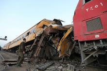 A policeman looks at the wreckage after a train crash in Kom Hamada in the northern province of Beheira, Egypt, February 28, 2018. PHOTO BY REUTERS/Mohamed Abd El Ghany