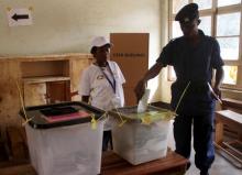 A policeman casts his vote at a polling station during a parliamentary election in Burundi's capital Bujumbura, June 29, 2015. PHOTO BY REUTERS/Jean Pierre Harerimana