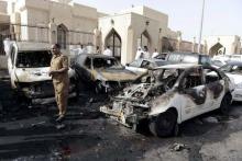 A policeman carries out an inspection after a car exploded near the Shi'ite al-Anoud mosque mosque in Saudi Arabia's Dammam, May 29, 2015. PHOTO BY REUTERS/Faisal Al Nasser