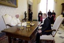 Russian President Vladimir Putin (R) meets Pope Francis during a private meeting at Vatican City, June 10, 2015. PHOTO BY REUTERS/Gregorio Borgia