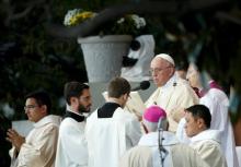 Pope Francis (2R) celebrates Mass at the National Shrine of the Immaculate Conception for the Canonization Mass for Friar Junipero Serra in Washington, September 23, 2015. PHOTO BY REUTERS/Kevin Lamarque