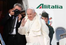 Pope Francis waves as he boards a plane for a two day visit to Ireland at the Leonardo da Vinci-Fiumicino Airport in Rome, Italy, August 25, 2018. PHOTO BY REUTERS/Remo Casilli