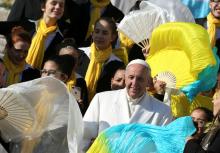 Pope Francis poses with a group of Brazilian faithful during his Wednesday general audience in Saint Peter's square at the Vatican, January 24, 2018. PHOTO BY REUTERS/Tony Gentile