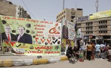 An election poster of Mahmoud Al-Hassan of Prime Minister Nuri al-Maliki's State of Law coalition is displayed along a street at the start of the election campaign in Baghdad
