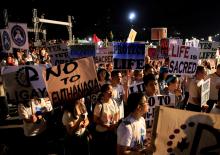 Participants display placards as they participate in a procession against plans to reimpose death penalty and intensify drug war during "Walk for Life" in Luneta park, Metro Manila, Philippines, February 24, 2018. PHOTO BY REUTERS/Romeo Ranoco
