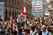 People hold a poster of Yemen's former president Ali Abdullah Saleh as they demonstrate outside a parliament session held for the first time since a civil war began almost two years ago, in Sanaa, Yemen August 13, 2016. PHOTO BY REUTERS/Khaled Abdullah
