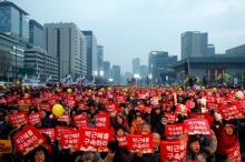 People attend a protest demanding South Korean President Park Geun-hye's resignation in Seoul, South Korea December 17, 2016. The signs read "Arrest Park Geun-hye". PHOTO BY REUTERS/Kim Hong-Ji