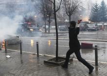 An anti-government protester throws a stone to the police during a demonstration in central Pristina, January 27, 2015. PHOTO BY REUTERS/Hazir Reka