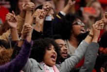 Protestors hold hands in the air as they yell at U.S. Republican presidential candidate Donald Trump during a campaign event in Radford, Virginia, February 29, 2016. PHOTO BY REUTERS/Chris Keane