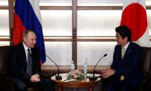 Russia's President Vladimir Putin (L) talks with Japan's Prime Minister Shinzo Abe at the start of their summit meeting in Nagato, Yamaguchi prefecture, Japan, December 15, 2016. PHOTO BY REUTERS/Toru Hanai