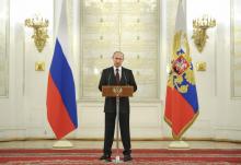 Russian President Vladimir Putin speaks during a ceremony with newly appointed high-ranking military officers in Moscow's Kremlin