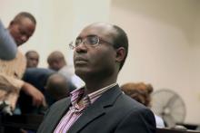 Journalist Rafael Marques de Morais sits in court in Luanda, Angola, May 28, 2015. PHOTO BY REUTERS/Herculano Coroado