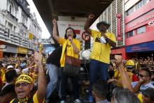 Pro-democracy group "Bersih" (Clean) chairwoman Maria Chin Abdullah (C) rallies supporters as they prepare to march towards Dataran Merdeka in Malaysia's capital city of Kuala Lumpur, August 29, 2015. PHOTO BY REUTERS/Edgar Su