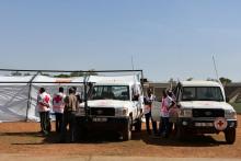 Red Cross members stand at the municipal stadium where an emergency medical post was established, after a coordinated assault on the army headquarters and French embassy in the capital Ougadougou, Burkina Faso, March 2, 2018. PHOTO BY REUTERS/Anne Mimault