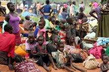 South Sudanese refugees gather with their belongings after crossing into Uganda at the Ngomoromo border post in Lamwo district, northern Uganda, April 4, 2017. PHOTO BY REUTERS/Stringer