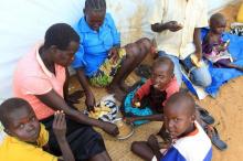 A South Sudan refugee family share a meal at the UNHCR managed refugees reception point at Elegu, within Amuru district of the northern region near the South Sudan-Uganda border, August 20, 2016. PHOTO BY REUTERS/James Akena