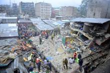Rescue workers search for residents feared trapped in the rubble of a six-storey building that collapsed after days of heavy rain, in Nairobi, Kenya, April 30, 2016. PHOTO BY REUTERS/John Muchucha