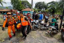 LABUAN, Indonesia (Reuters) - Indonesian military and rescue teams fanned out across a stretch of coastline on Monday, hoping to find survivors of a tsunami triggered by an underwater landslide from a volcano that has been erupting for months.  Authorities called for vigilance amid the spewing of ash by Anak Krakatau, a volcanic island where a crater collapse late on Saturday together with a high tide set off waves that smashed into coastal areas, killing at least 281 people.  Rescuers using heavy machinery