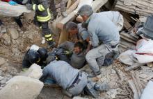 A man is rescued alive from the ruins following an earthquake in Amatrice, central Italy, August 24, 2016. PHOTO BY REUTERS/Remo Casilli