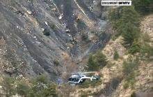 A rescue helicopter from the French Gendarmerie hovers in front of the crash site of an Airbus A320, near Seyne-les-Alpes, March 24, 2015 in this still image taken from TV. PHOTO BY REUTERS/BFM via Reuters TV