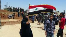 Residents celebrate the army's arrival in the formerly rebel-held town of Ibta, northeast of Deraa city, Syria in this handout released on June 29, 2018. PHOTO BY REUTERS/SANA