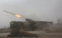 Popular Mobilization Forces (PMF) fire towards Islamic State militants during a battle on the outskirts of Al-Ba'aj, west of Mosul, Iraq, May 26, 2017. PHOTO BY REUTERS/Stringer