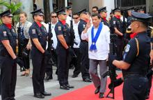 President Rodrigo Duterte salutes while passing members of custom police, during the 116th Bureau of Customs founding anniversary in Metro Manila, Philippines, February 6, 2018. PHOTO BY REUTERS/Romeo Ranoco