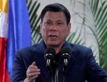 Philippine President Rodrigo Duterte interacts with reporters during a news conference upon his arrival from a four-day state visit in China at the Davao International Airport in Davao city, Philippines October 21, 2016. REUTERS/Lean Daval Jr.