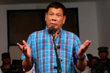 Philippine President Rodrigo Duterte gestures during a briefing with the military after his visit at Camp General Basilio Navarro in Zamboanga City, Philippines, November 25, 2016. PHOTO BY REUTERS/Malacanang Photo