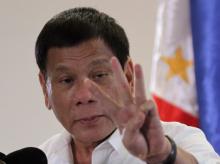 Philippine President Rodrigo Duterte speaks upon his arrival at Davao International Airport in Davao city, Philippines, after returning from an APEC summit meeting in Peru, November 23, 2016. PHOTO BY REUTERS/Lean Daval Jr