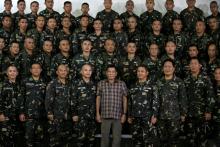Philippine President Rodrigo Duterte poses with soldiers during a visit at Capinpin military camp in Tanay, Rizal in the Philippines, August 24, 2016. PHOTO BY REUTERS/Erik De Castro
