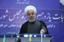 Iranian President Hassan Rouhani casts his vote at a polling station during parliamentary elections in Tehran, Iran, February 21, 2020. PHOTO BY Official Presidential website