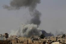 Smoke rises after an air strike during fighting between members of the Syrian Democratic Forces and Islamic State militants in Raqqa, Syria, August 20, 2017. PHOTO BY REUTERS/Zohra Bensemra