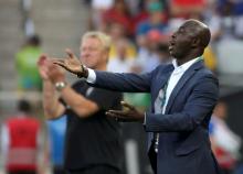 Nigeria's former head coach Samson Siasia (R) reacts next to Germany's head coach Horst Hrubesch during the second half. PHOTO BY REUTERS/Paulo Whitaker