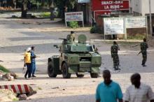 Soldiers patrol the streets in a military vehicle as civilians celebrate in Burundi's capital Bujumbura, May 13, 2015. REUTERS/Jean Pierre Aime Harerimana