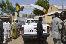 Security officers stand at the site of a suicide bombing in Ndjamena, Chad, June 15, 2015. PHOTO BY REUTERS/Moumine Ngarmbassa