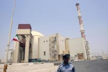 A security official stands in front of the Bushehr nuclear reactor, 1,200 km (746 miles) south of Tehran, August 21, 2010. PHOTO BY REUTERS/Raheb Homavandi