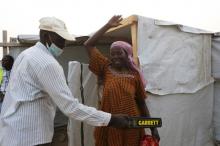 A security officer scans a woman entering a health clinic at Minawao refugee camp in Minawao, Cameroon, March 15, 2016. PHOTO BY REUTERS/Joe Penney