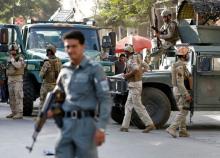 Afghan security forces leave the site of a suicide attack followed by a clash between Afghan forces and insurgents after the attack on Iraq embassy in Kabul, Afghanistan, July 31, 2017. PHOTO BY REUTERS/Omar Sobhani