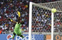 Goalkeeper Senzo Meyiwa of South Africa's Orlando Pirates is beaten by a goal made by Mohamed Aboutrika of Egypt's Al Ahli during the first leg of their African Champions League final soccer match at Orlando Stadium in Soweto, November 2, 2013. PHOTO BY REUTERS/Siphiwe Sibeko