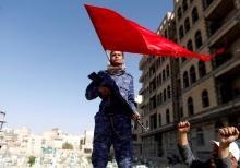 A Shiite Houthi fighter stands guard at the site of a rally attended by fellows Houthis to mark Ashura and the 4th anniversary of their takeover of the Yemeni capital, in Sanaa, Yemen, September 20, 2018. PHOTO BY REUTERS/Khaled Abdullah