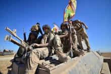 Shi'ite Popular Mobilization Forces (PMF) with Iraqi army gather on the outskirts of Tal Afar. PHOTO BY REUTERS/Stringer