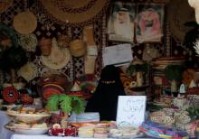 A Saudi woman sits in her shop at heritage village during Gulf Coastal Cultural Festival at Dammam Corniche, Dammam, Saudi Arabia, April 20, 2018. PHOTO BY REUTERS/Hamad I Mohammed