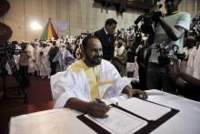 Sidi Brahim Ould Sidati of the Coordination of Movements for Azawad signs a peace agreement in Bamako, Mali, June 20, 2015. PHOTO BY REUTERS/Stringer