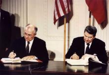 U.S. President Ronald Reagan (R) and Soviet President Mikhail Gorbachev sign the Intermediate-Range Nuclear Forces (INF) treaty at the White House, Washington, on December 8 1987. PHOTO BY REUTERS/Stringer