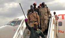 General Simon Gatwech Dual, the chief of staff of the rebel troops of the Sudan People's Liberation Army in Opposition (SPLA-IO), waves to supporters as he arrives at the Juba International Airport in South Sudan's capital Juba, April 25, 2016. PHOTO BY REUTERS/Jok Solomun