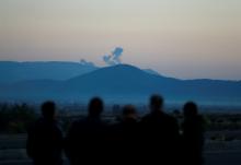 Smoke rises from the Syria's Afrin region, as it is pictured from near the Turkish town of Hassa, on the Turkish-Syrian border in Hatay province, Turkey, January 20, 2018. PHOTO BY REUTERS/Osman Orsal