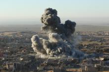 Smoke rises from the site of U.S.-led air strikes in the town of Sinjar, November 12, 2015. PHOTO BY REUTERS/Ari Jalal