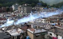 Smoke rises as a vehicle carries out fumigation through a town in Seoul, South Korea, June 12, 2015. PHOTO BY REUTERS/Seo Myeong-gon